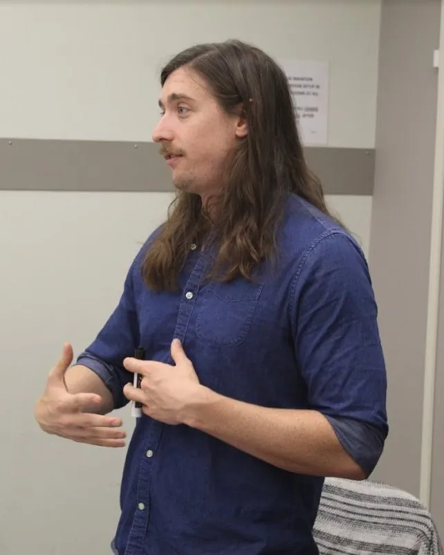 Nick teaching at a whiteboard